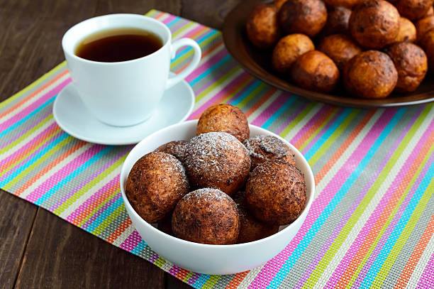 istock Vanilla cheese balls, deep fried and a cup of tea 616265184