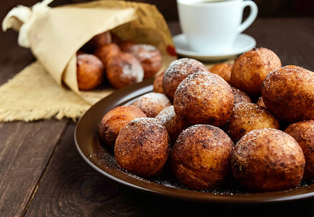 istock Vanilla cheese balls, deep fried and a cup of tea. 616265386