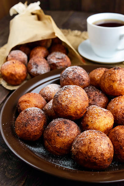 istock Vanilla cheese balls, deep fried and a cup of tea. 616265648