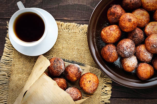 istock Vanilla cheese balls, deep fried and a cup of tea. 616265960