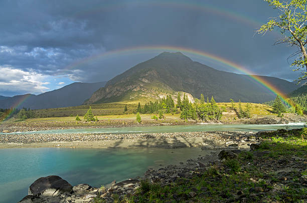 istock Rainbow over the river. Altai Mountains, Russia. 616852908