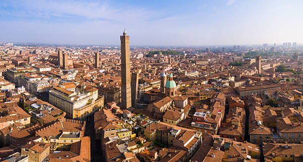 Two Towers, Bologna The Two Towers  both of them leaning, are the symbol of Bologna, Italy, and the most prominent of the Towers of Bologna. They are located at the intersection of the roads that lead to the five gates of the old ring wall. emilia romagna photos stock pictures, royalty-free photos & images