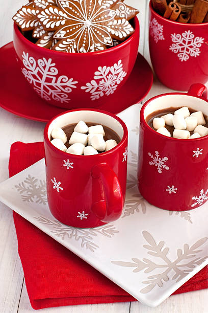 istock Mug with hot chocolate  and gingerbread cookies on wooden table 616862298
