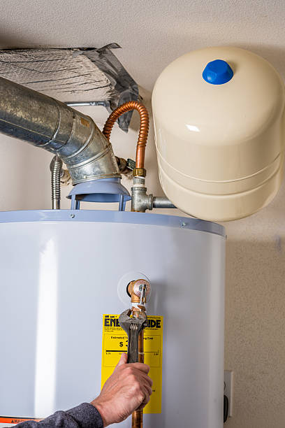 istock Wrench used to work on a water heater 616862654