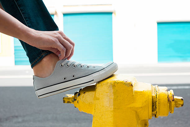 istock Prison putting on pair of shoes 616864976