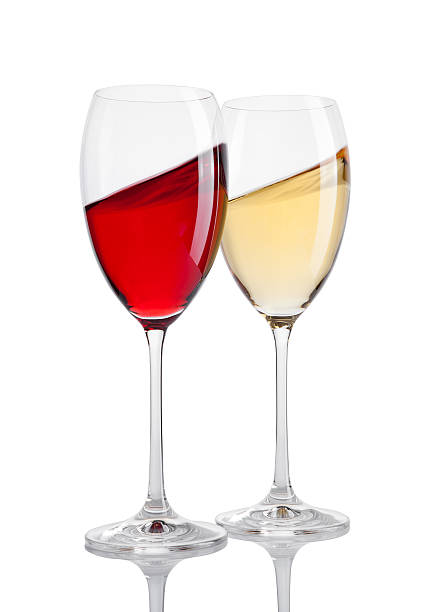 istock Glass of red and white wine in motion on white 616868146