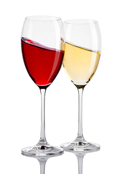 istock Glass of red and white wine in motion on white 616868206