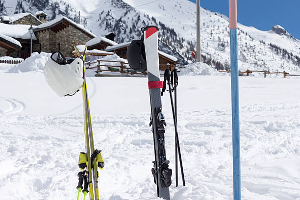 istock skis in the snow with background blue sky 616868506