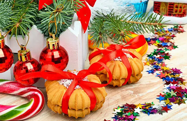 Christmas background, cake, lollipops and pine twig.