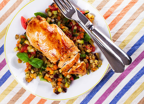 istock Fried chicken breast with sauteed vegetables 616870464