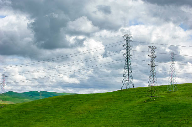 istock Pylons, Power Lines and Clouds 616871856
