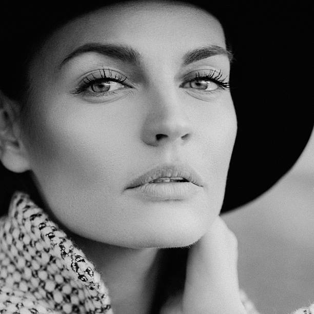 Beautiful girl with make-up, Dressed in old-fashioned coat and hat