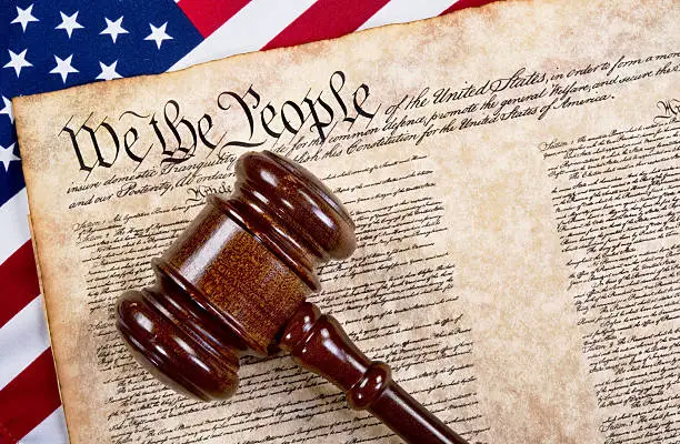 Bill of rights, we the people with wooden gavel and American flag.