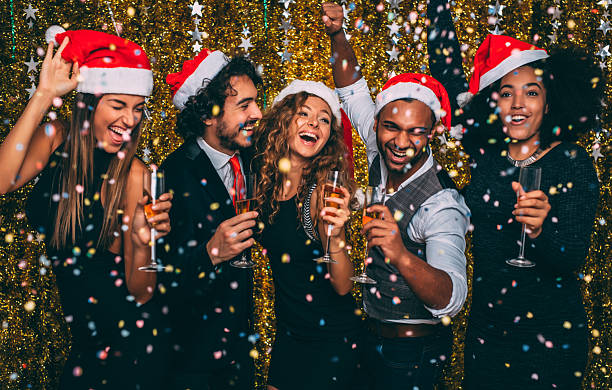 Christmas party Friends having a christmas party. office parties stock pictures, royalty-free photos & images