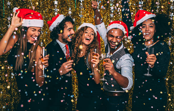 Christmas party Friends having a christmas party. office party stock pictures, royalty-free photos & images