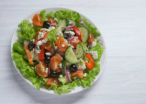 istock Fresh vegetable Greek salad, top view 616876848