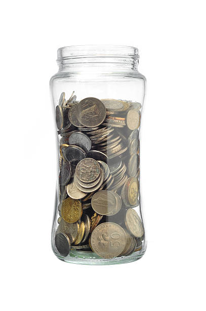 istock Coins in the jar on white background 616878008