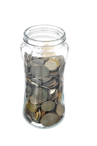 istock Coins in the jar on white background 616878088