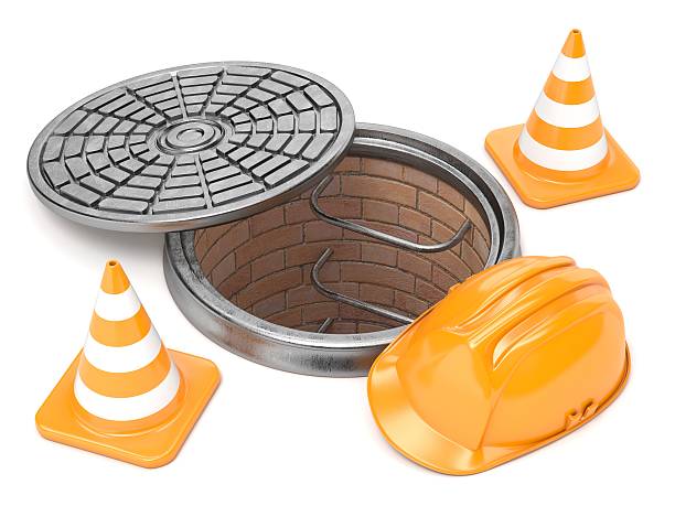 istock Manhole, traffic cones and safety helmet. 3D 616878502