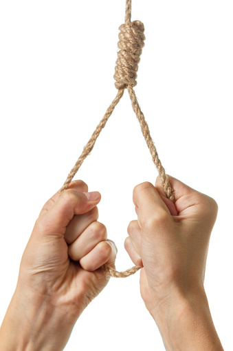 Hands holding a loop of rough rope isolate on white background