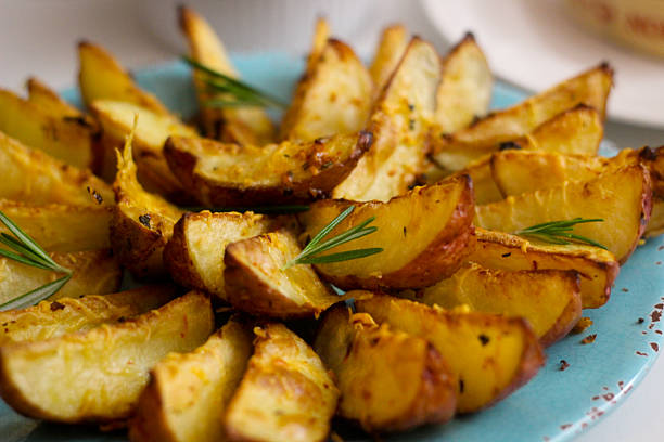 istock Oven Baked Potato Wedges 616879980