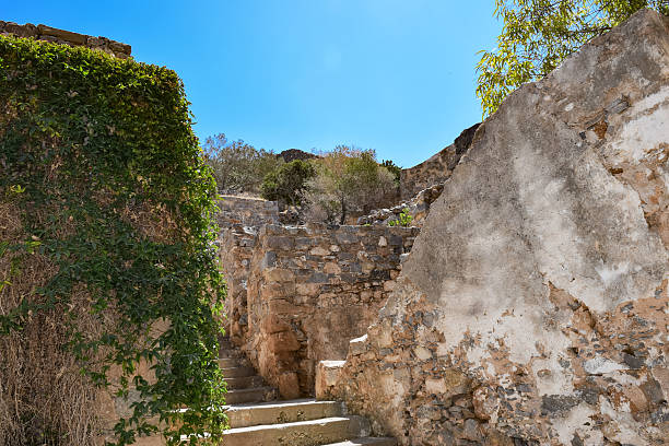 istock Ruins in the abandoned leper colony Spinalonga, Crete 616880378