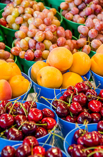 istock Fresh cherries, apricots and red grapes in pots 616881144