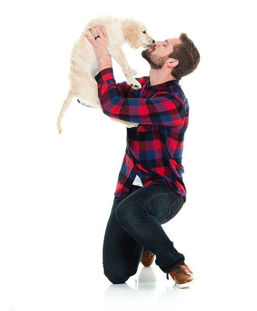 istock Man kissing with his dog 616881736