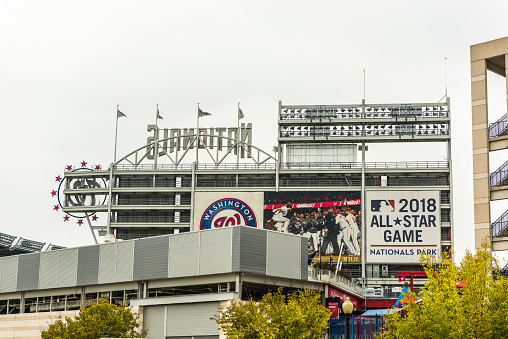 Washington DC, USA - September 24, 2016: Nationals park building stadium with sign and flags on overcast day in downtown