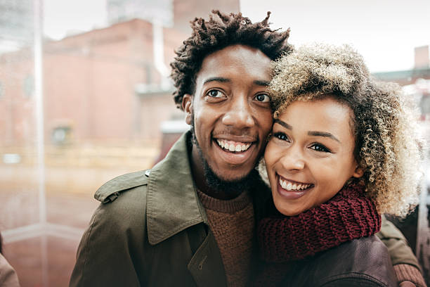 istock Happy couple in a rainy day 616883508