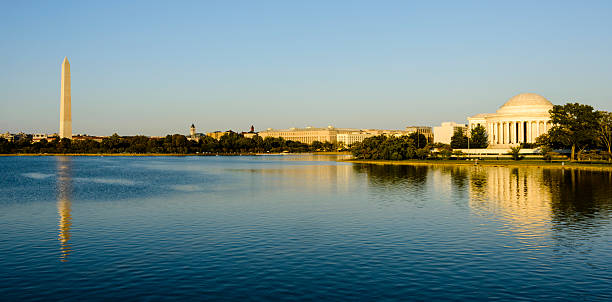 istock Panoramic of Washington DC tidal basin. Jefferson Memorial, Washington Monument 616883542