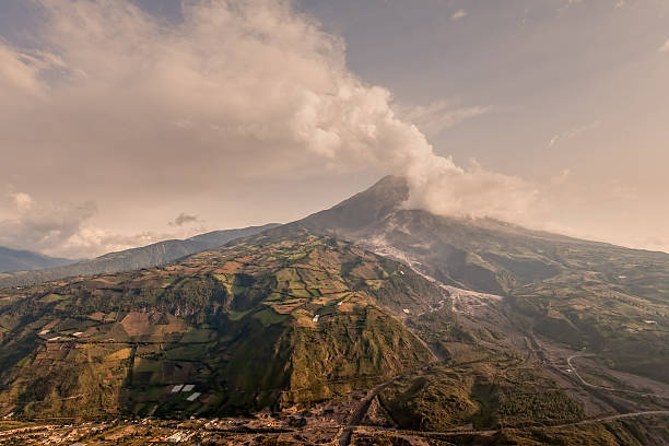 Tungurahua, Quantity Of Ash Darkening The Blue Clear Sky Tungurahua Volcano Powerful Eruption, Large Quantity Of Ash Darkening The Blue Clear Sky, Ecuador, South America mt tungurahua sunset mountain volcano stock pictures, royalty-free photos & images