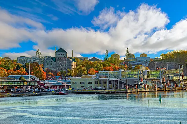 Early autumn morning panorama of the Port of Turku, Finland, with Turku Castle at background