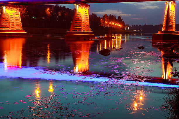 istock bridge night city reflected in water Uzhorod 616887220