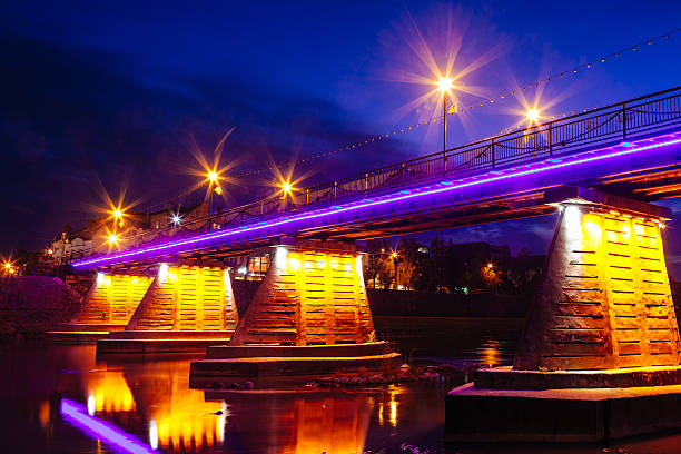 istock bridge night city reflected in water Uzhorod 616887278