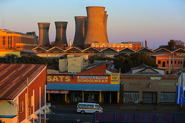 Bulawayo, Zimbabwe – August 21, 2016: The sun rises illuminating the Bulawayo Power Station and the adjacent neighborhood.