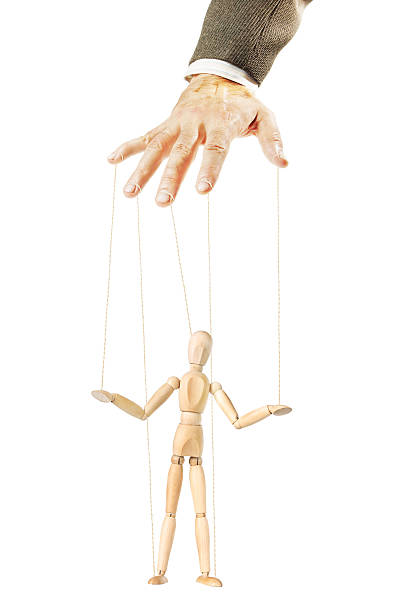 istock One person controls the other like a puppet 616889648