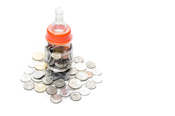 istock Malaysia Coins in Baby Bottle Conceptual Image 616890738