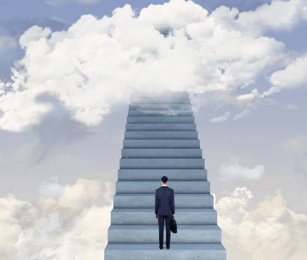 istock Businessman standing on steps to achieve success 616892358