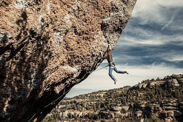 istock Woman during rock climbing practice 616892698