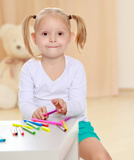 istock The girl draws with markers 616894626
