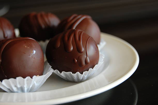 istock Healthy chocolate truffles with nuts and dates 616894692