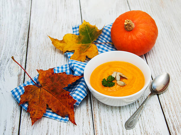istock Pumpkin soup with fresh pumpkins 616894852