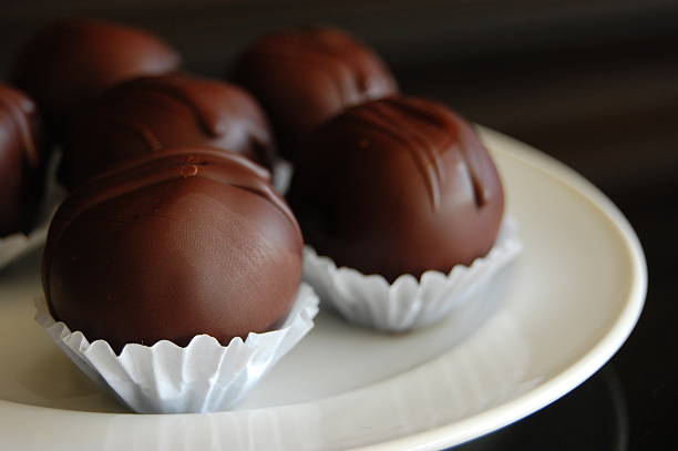 istock Healthy chocolate truffles with nuts and dates 616894958
