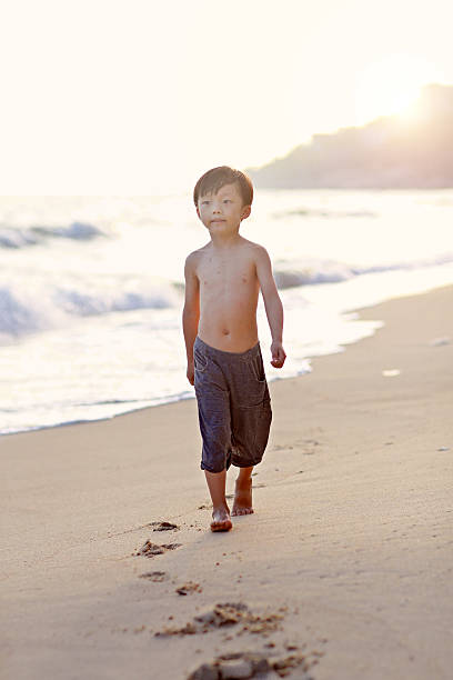 istock Children playing on the beach 616895060