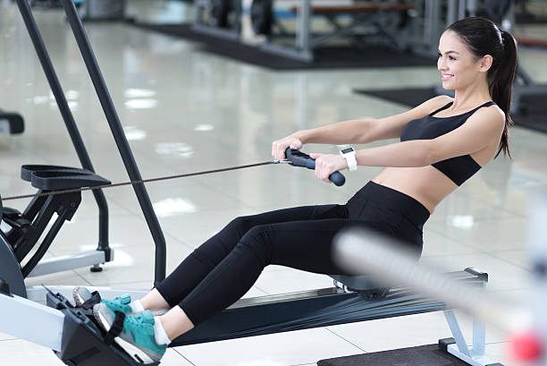 istock Happy woman spending time in a gym 616898040