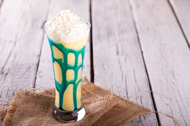 istock banana milkshake on a white wood background 616900720