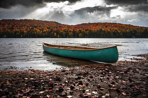 istock Journey at Park, Canada. Canoe in front of the lake 616902940