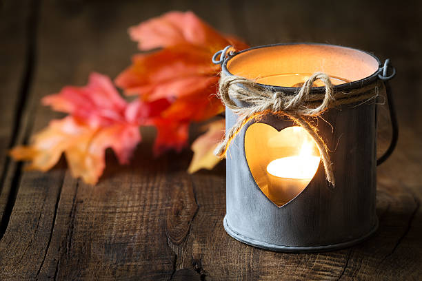 Lantern with autumn leaves stock photo