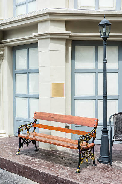 istock chair on neo classic building street. 616904146
